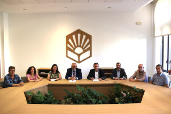Imagen que representa la firma del acuerdo.